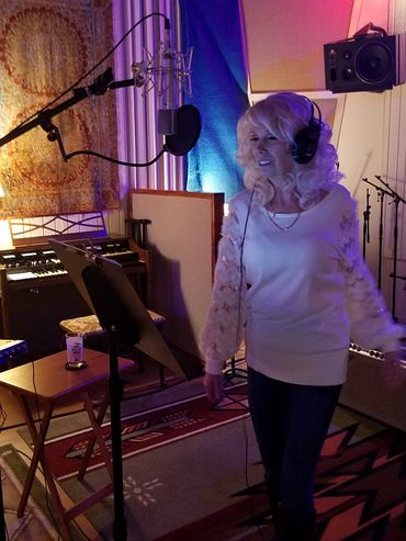 Artist recording vocals in studio